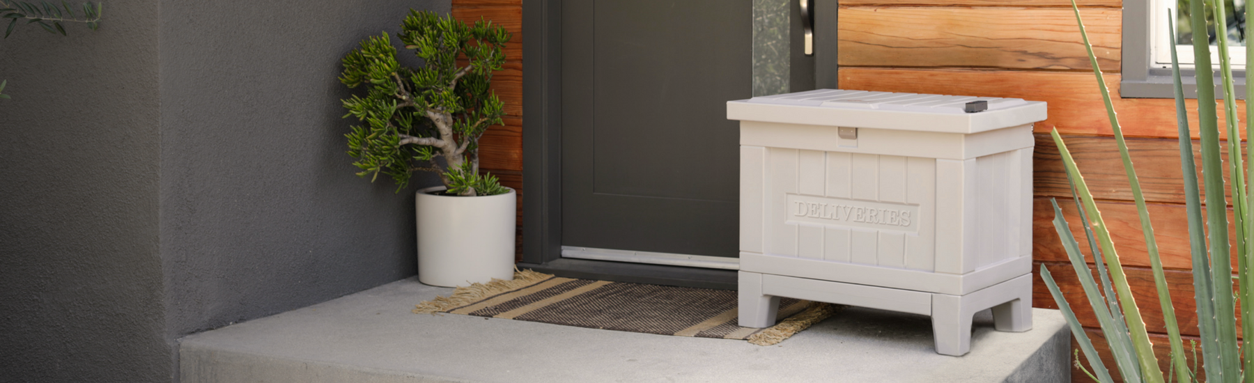 Yale Smart Delivery Box Ken in Manor Gray sitting on front porch to secure package deliveries