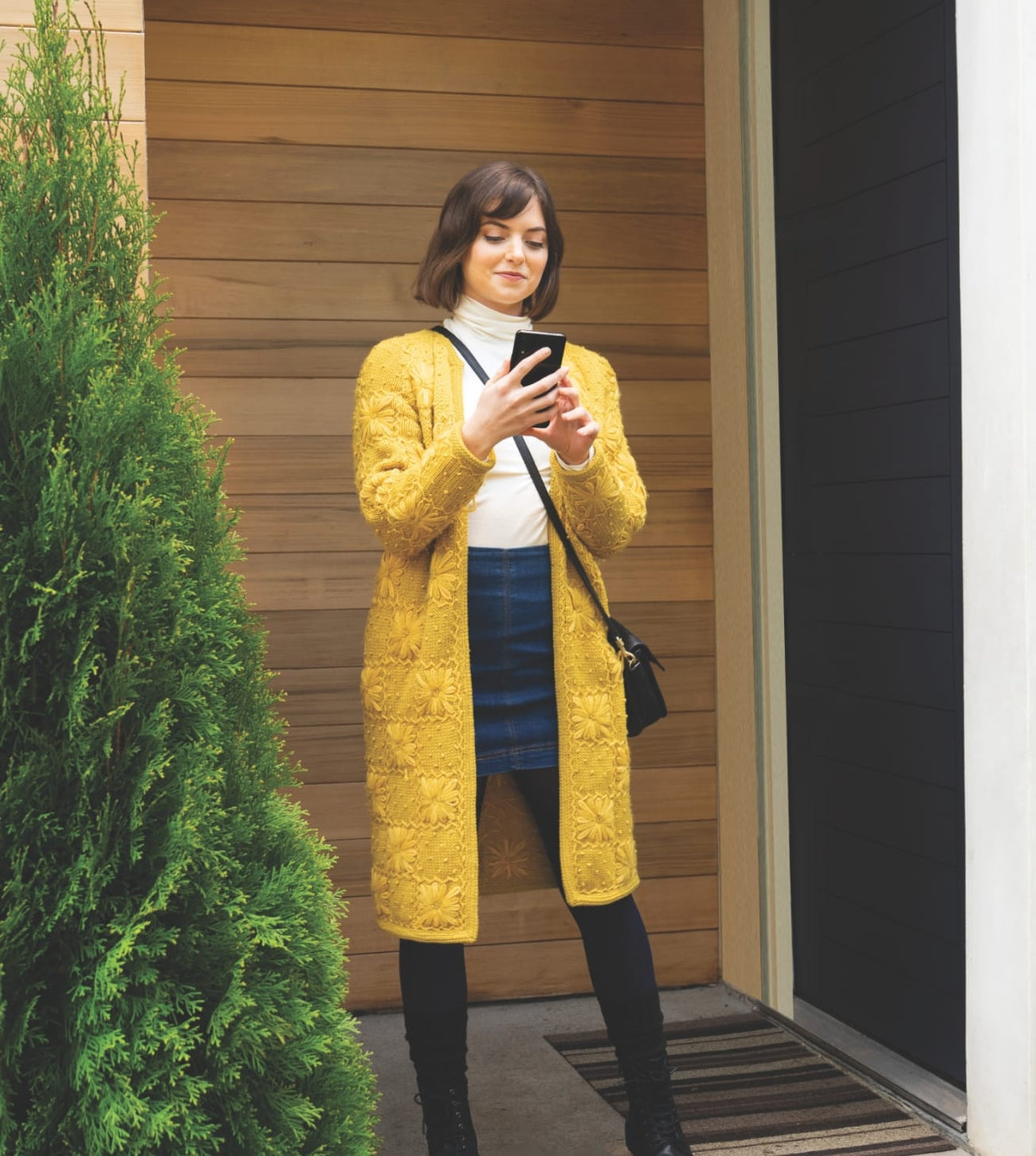 Woman using Yale Locks that work with ring and compatible with Samsung phone to ensure lock safety