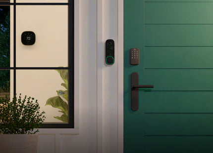 ecobee product and Yale Lock on green door