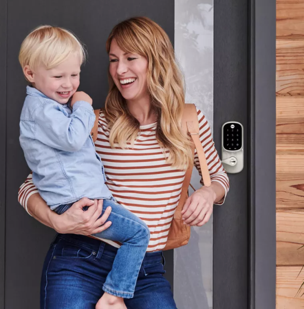 Mom with kid accessing side entrance with Yale Assure Lever lock