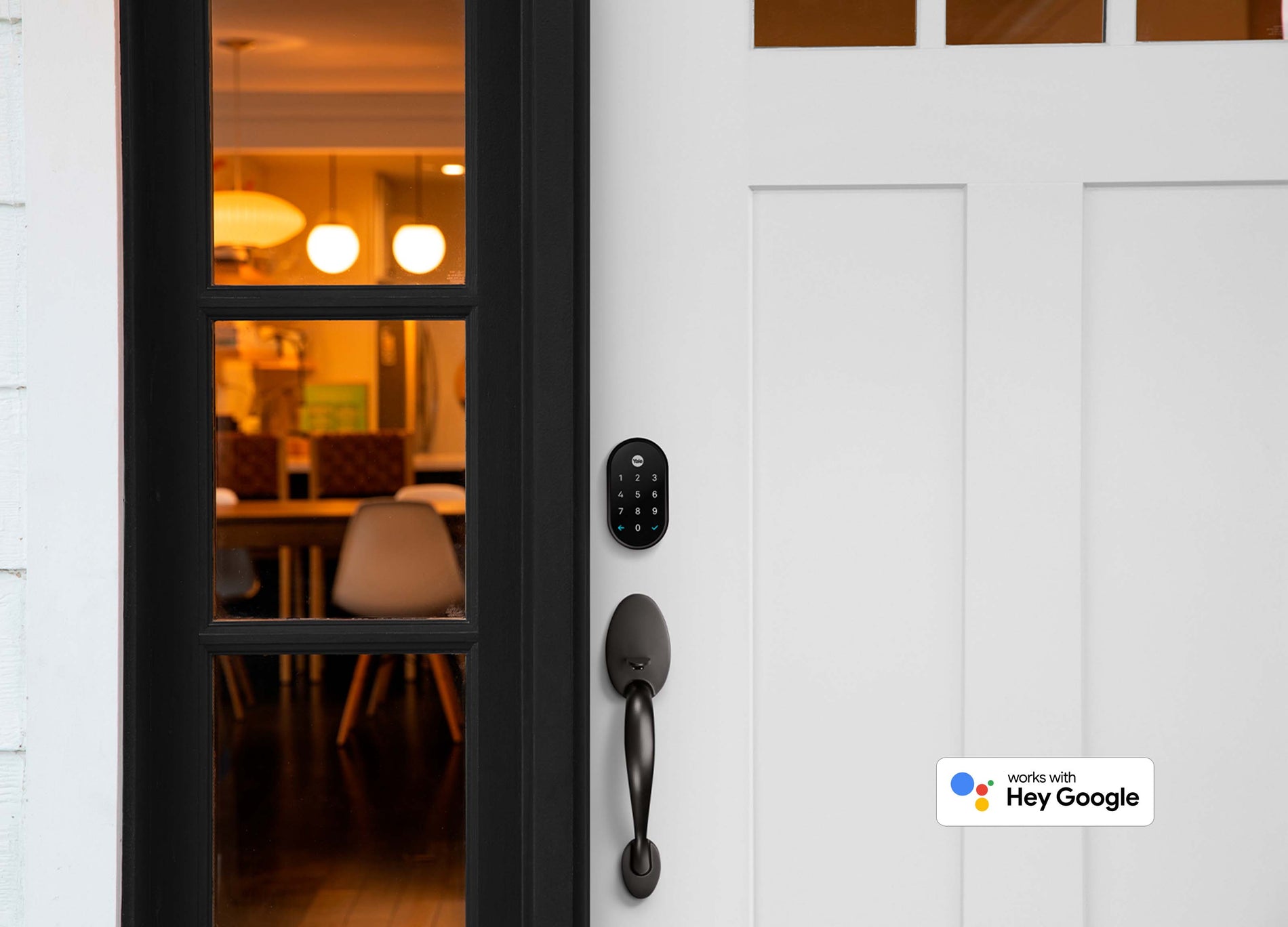 Nest x Yale Door Lock on front door in black suede & pairs with Hey Google