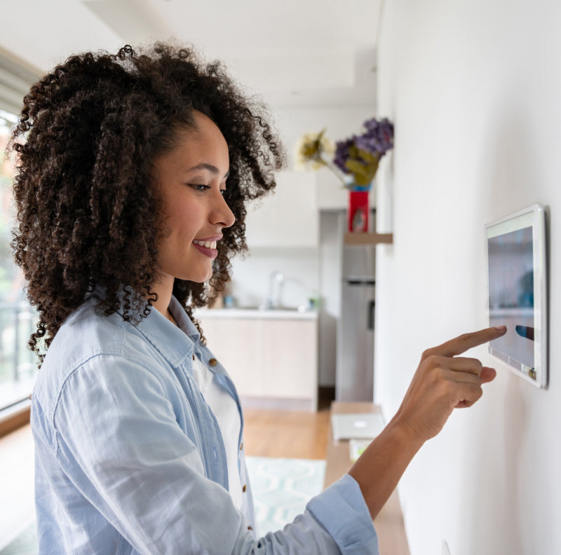 woman using smart home panel