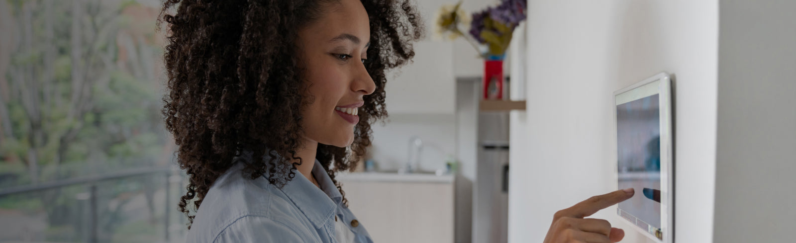 woman using smart house panel