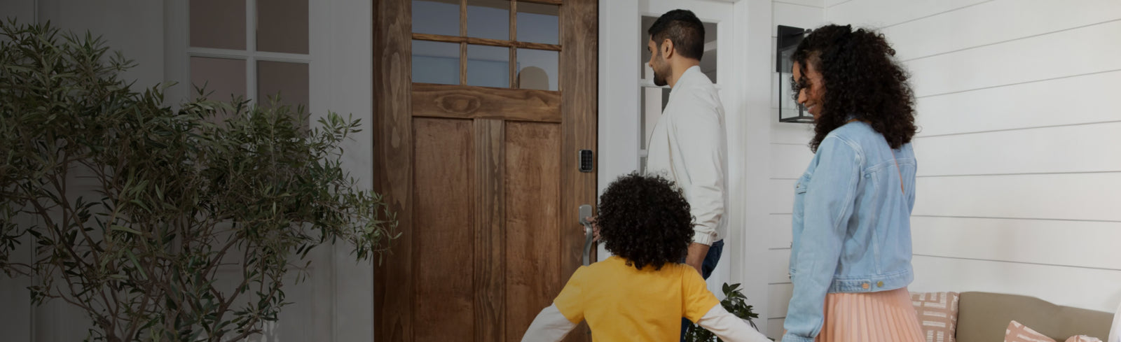 family opening a door