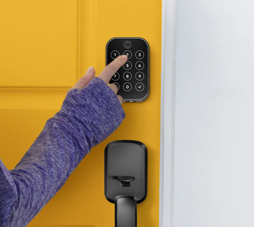Person accessing Airbnb property with keypad codes