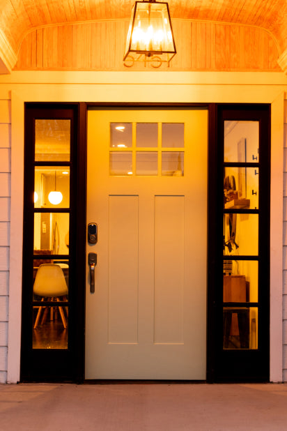 image of front door with lights on using smart lighting.